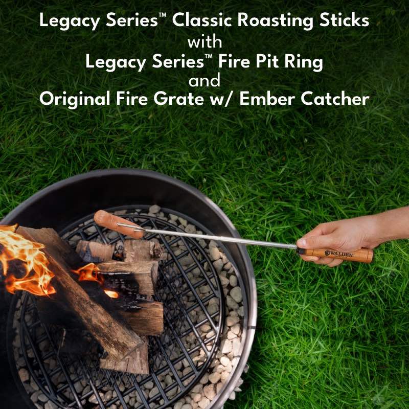 Roasting sticks with hotdog roasting over a fire in the Legacy Fire Pit Ring.