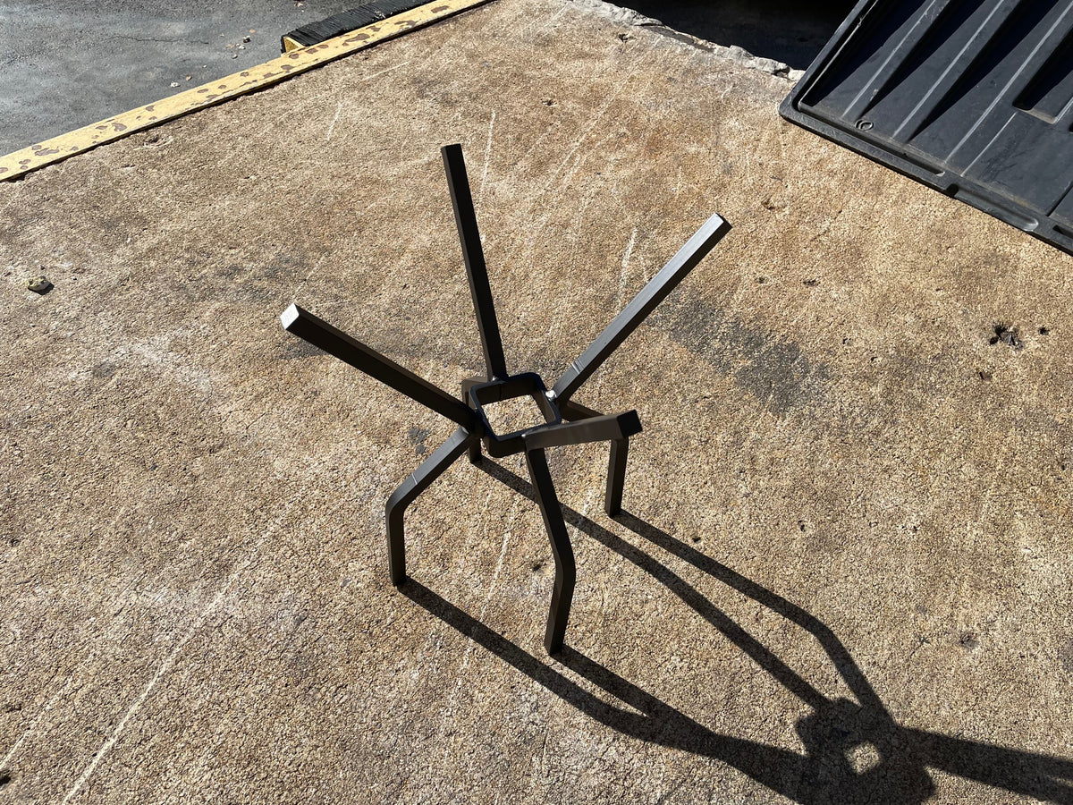 Tee Pee fire pit grate, a welded steel cone for stacking firewood